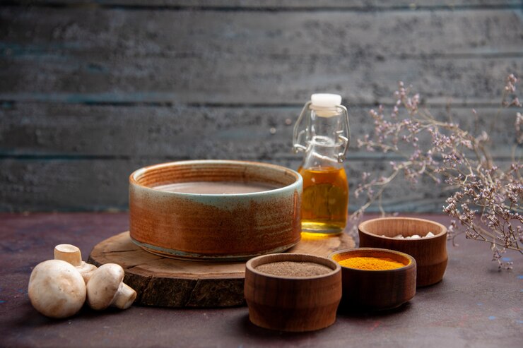 front-close-view-tasty-mushroom-soup-with-different-seasonings-dark-space_140725-79225